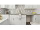 Close up of the kitchen counters, cabinets, and gold fixtures at 169 Wadley Nw St, Atlanta, GA 30314