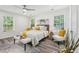 Light and bright main bedroom featuring two windows and neutral decor at 169 Wadley Nw St, Atlanta, GA 30314