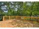 Large wooden deck surrounded by trees, creating a serene and private outdoor retreat at 169 Wadley Nw St, Atlanta, GA 30314