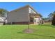 Spacious, green backyard featuring a covered patio, ideal for relaxation and entertaining at 3218 Hidden Valley Cir, Lawrenceville, GA 30044