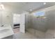 Luxurious bathroom with a double vanity, oversized shower with glass door and tile surround at 3218 Hidden Valley Cir, Lawrenceville, GA 30044