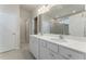 Bathroom with double vanity, white countertops and cabinets and a large mirror at 3218 Hidden Valley Cir, Lawrenceville, GA 30044