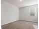 Bright bedroom features neutral carpet, and a large window overlooking the front yard at 3218 Hidden Valley Cir, Lawrenceville, GA 30044