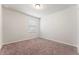 Spare bedroom with a window and neutral-colored carpet at 3218 Hidden Valley Cir, Lawrenceville, GA 30044