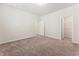 An expansive bedroom with carpet and convenient access to a spacious closet at 3218 Hidden Valley Cir, Lawrenceville, GA 30044