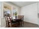 Cozy dining area with large window, wood table set, and a large bank of built-in cabinets at 3218 Hidden Valley Cir, Lawrenceville, GA 30044