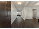 Elegant entryway with hardwood floors, decorative molding, and an open view into the living spaces at 3218 Hidden Valley Cir, Lawrenceville, GA 30044