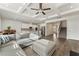 Bright, open-concept space with a modern kitchen, dining area, and living room featuring hardwood floors at 3218 Hidden Valley Cir, Lawrenceville, GA 30044