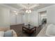 Stylish living room featuring hardwood floors and decorative molding, with a view into the adjacent rooms at 3218 Hidden Valley Cir, Lawrenceville, GA 30044