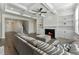 Spacious living room with fireplace, hardwood floors, built-in bookshelves, and abundant natural light at 3218 Hidden Valley Cir, Lawrenceville, GA 30044