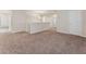Large carpeted loft featuring a railing, multiple doorways, and overhead lighting at 3218 Hidden Valley Cir, Lawrenceville, GA 30044