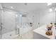 A modern bathroom featuring a glass-enclosed shower and separate soaking tub at 120 Woodford Ln, Canton, GA 30115