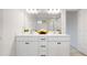 Bright bathroom with double sink vanity, contemporary lighting, and modern mirror at 120 Woodford Ln, Canton, GA 30115