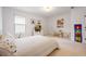 Bedroom with playful decor, bright window, and neutral colors at 120 Woodford Ln, Canton, GA 30115