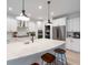 Spacious kitchen with white countertops, stainless steel appliances, and pendant lighting above the island at 120 Woodford Ln, Canton, GA 30115