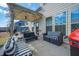 Covered patio with seating area, ceiling fan, and view of backyard at 120 Woodford Ln, Canton, GA 30115