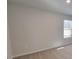 Bright bedroom featuring neutral carpet, gray walls and natural light from the window at 15 Heyman Dr, Covington, GA 30016