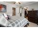 Comfortable bedroom featuring a ceiling fan, dark wood dresser, and walk-in closet at 2190 Rugby Ave, Atlanta, GA 30337