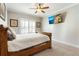 Cozy bedroom featuring a wood bed frame, plush carpet, and shuttered windows at 2190 Rugby Ave, Atlanta, GA 30337