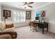 Bedroom featuring an executive desk, wall paneling, and a view of the backyard at 2190 Rugby Ave, Atlanta, GA 30337