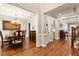 Elegant dining room featuring hardwood floors, coffered ceiling, and classic chandelier at 2190 Rugby Ave, Atlanta, GA 30337