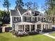 Gray two-story house with inviting front porch, black shutters, and well-maintained landscaping at 2190 Rugby Ave, Atlanta, GA 30337