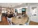 Open kitchen with stainless steel appliances, a kitchen island, and adjacent dining area at 2190 Rugby Ave, Atlanta, GA 30337