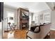 Cozy living room featuring a stone fireplace and a large window with shutters at 2190 Rugby Ave, Atlanta, GA 30337