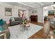 Open concept living room with hardwood floors, stylish furniture, and natural light at 2190 Rugby Ave, Atlanta, GA 30337