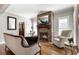 Charming living room with a stone fireplace, and hardwood floors at 2190 Rugby Ave, Atlanta, GA 30337