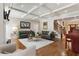 Bright living room featuring a coffered ceiling, hardwood floors, and a cozy fireplace at 2190 Rugby Ave, Atlanta, GA 30337