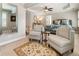 Spacious main bedroom sitting area with chairs and area rug at 2190 Rugby Ave, Atlanta, GA 30337