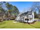 Beautiful home showcasing a spacious lawn, screened porch, and large deck perfect for outdoor entertaining at 2190 Rugby Ave, Atlanta, GA 30337