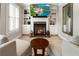 Sitting area with fireplace, built-ins, and natural light from windows at 2190 Rugby Ave, Atlanta, GA 30337