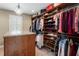 This walk-in closet features custom shelving, hanging racks, and center island with granite top at 2190 Rugby Ave, Atlanta, GA 30337