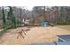 Large, private backyard with a playhouse and swing set at 3653 Memorial Nw Pkwy, Kennesaw, GA 30152