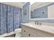 Updated bathroom featuring a vanity with countertop sink and a shower with a patterned curtain at 3653 Memorial Nw Pkwy, Kennesaw, GA 30152