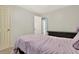 Bedroom with neutral colors and a door leading to the hallway and dresser at 3653 Memorial Nw Pkwy, Kennesaw, GA 30152