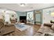 Bright living room with wood floors, and a large window providing natural light at 3653 Memorial Nw Pkwy, Kennesaw, GA 30152