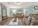 Bright living room with neutral paint, wood floors, and comfortable seating at 3653 Memorial Nw Pkwy, Kennesaw, GA 30152