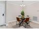 Bright dining room with modern lighting and seating for four at 4106 Pine Heights Ne Dr, Atlanta, GA 30324