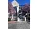 Inviting condo building entrance framed by beautiful blooming trees at 4106 Pine Heights Ne Dr, Atlanta, GA 30324