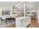 Open-concept dining and living area with hardwood floors and recessed lighting at 3306 Briarcliff Ne Rd, Atlanta, GA 30345