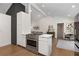 Bright kitchen with a stainless steel oven, white cabinets, and an open view to a casual living area at 3306 Briarcliff Ne Rd, Atlanta, GA 30345