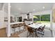 Bright kitchen with modern white cabinetry, stainless steel appliances, and an eat-in island at 3306 Briarcliff Ne Rd, Atlanta, GA 30345
