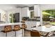 Modern kitchen featuring white cabinets, a marble countertop island, and stainless steel appliances at 3306 Briarcliff Ne Rd, Atlanta, GA 30345