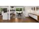 Bright kitchen and dining area with modern white cabinets, an island, and a view of the backyard at 3306 Briarcliff Ne Rd, Atlanta, GA 30345