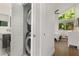 Conveniently located laundry area with stacked washer and dryer, adjacent to a bright bedroom at 3306 Briarcliff Ne Rd, Atlanta, GA 30345
