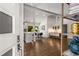 Open-concept living space with hardwood floors, white walls, modern lighting, and stylish decor at 3306 Briarcliff Ne Rd, Atlanta, GA 30345