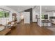 Open-concept living room with hardwood floors and modern finishes flows into kitchen at 3306 Briarcliff Ne Rd, Atlanta, GA 30345